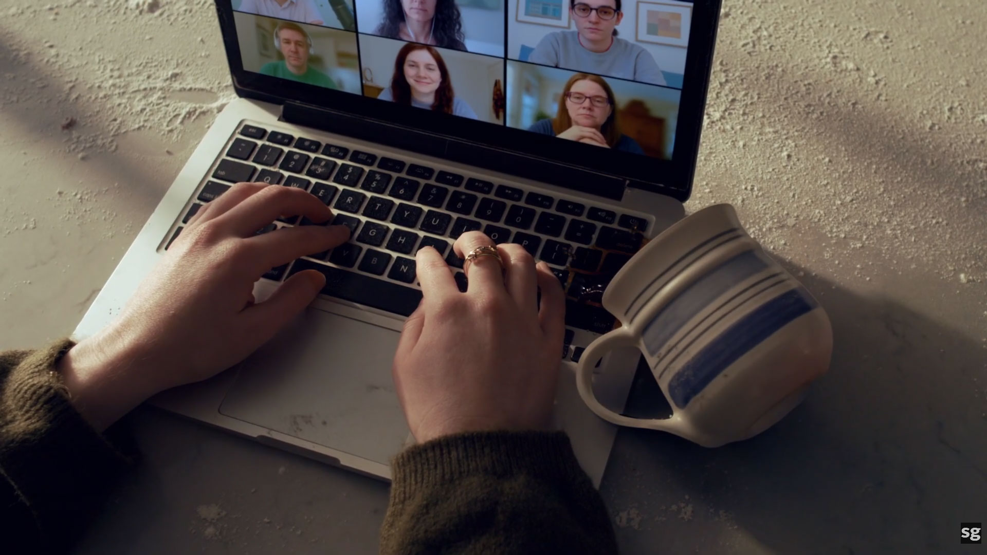 High-end cinematography of a coffee spill on a laptop keyboard, part of a hybrid AI-scripted commercial.