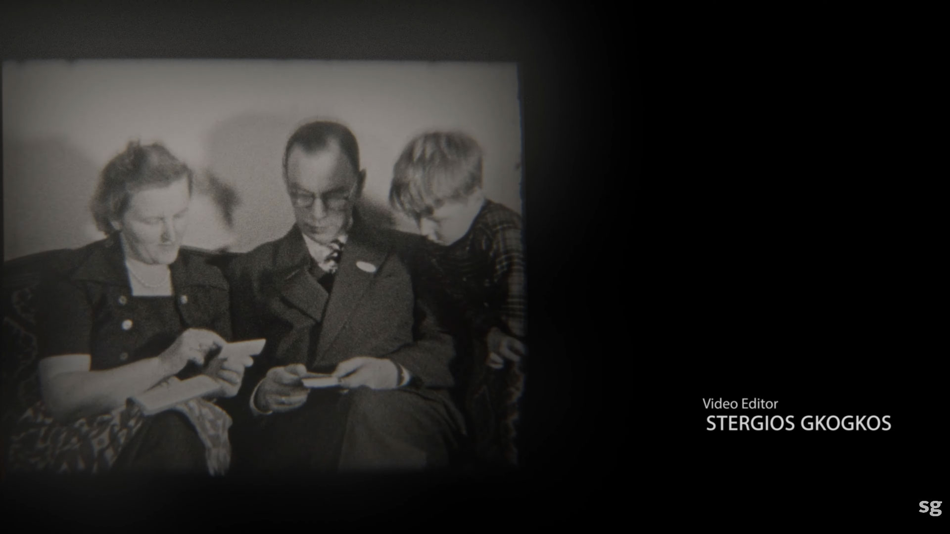 A family viewing photos in a vintage black and white frame, featuring the video editor credit for Stergios Gkogkos.