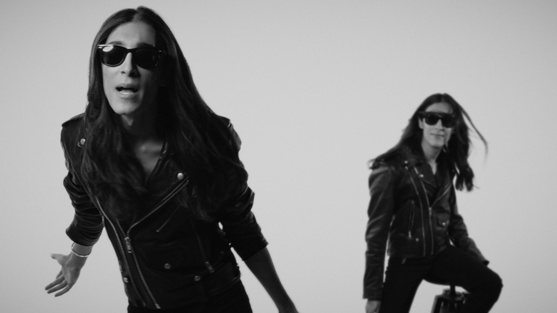 Detailed skin retouching and high-impact visuals achieved through music video editing and color grading.